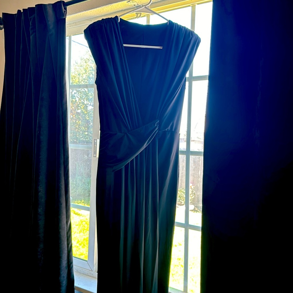 Beautiful black, long fancy dress open chest worn for a wedding.